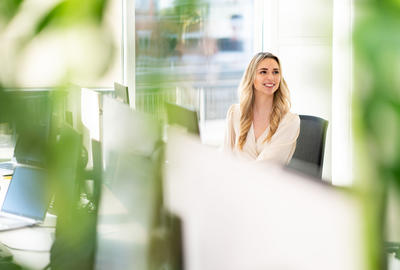 Young woman working at a desk in an office